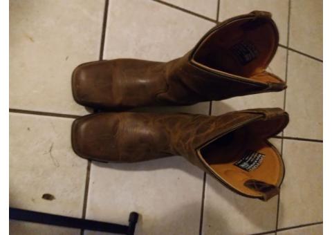 A pair of Dan post cowboy boots use them to work or play in
